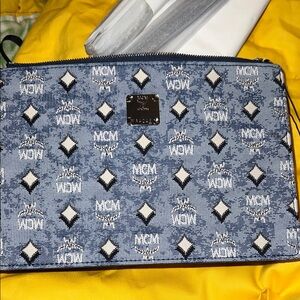 MCM Aren Wallet on a Chain in blue denim.